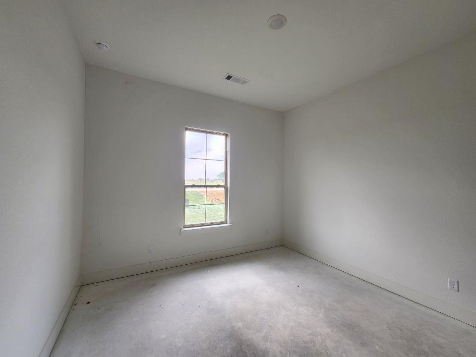 2408 Quartz Street Krum, TX 76249 - Photo 14 of 16 an empty room with a window