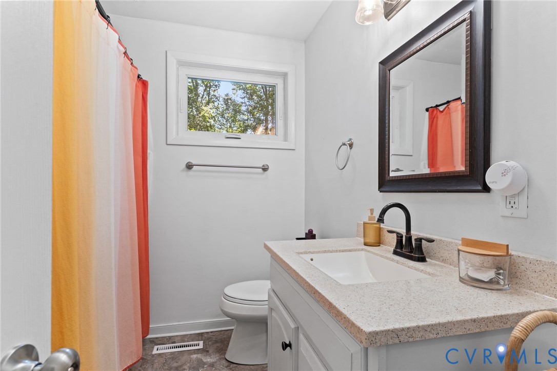 2448 Mountain View Road Powhatan, VA 23139 - Photo 11 of 29 Bathroom features an updated vanity and vinyl tile