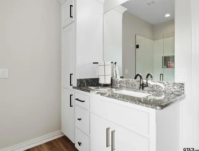 a bathroom with a sink and a mirror