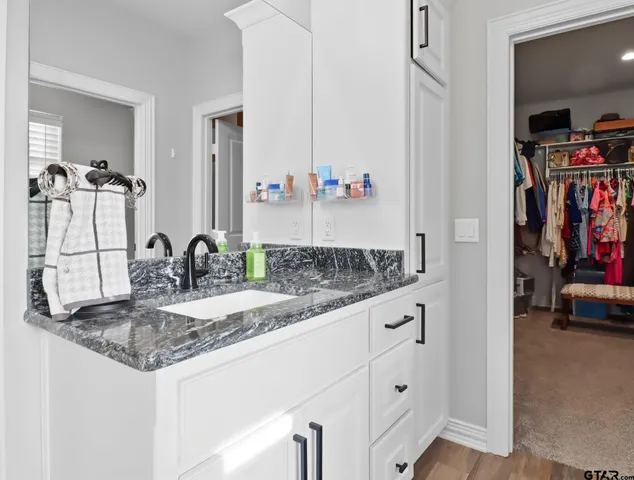 a bathroom with sink and a mirror