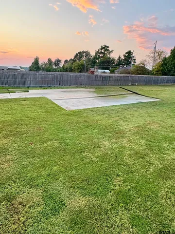 a view of outdoor space with swimming pool and green space