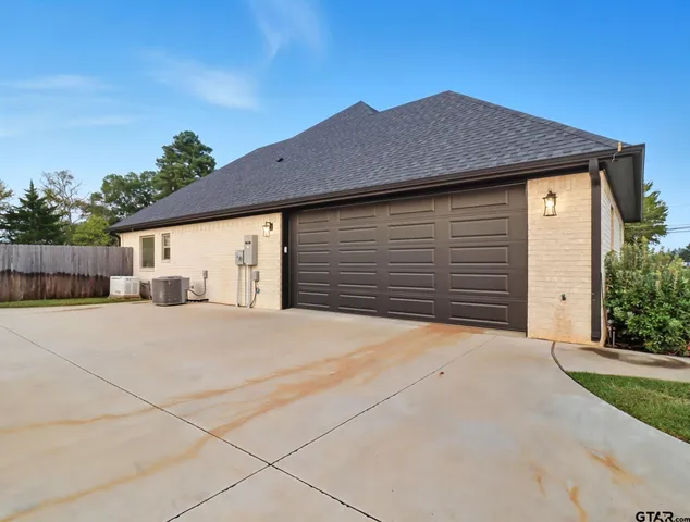 a front view of a house with a garage