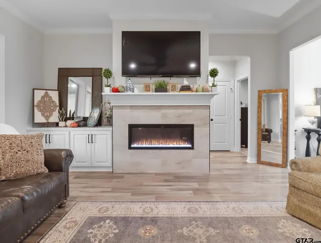 a living room with furniture and a flat screen tv