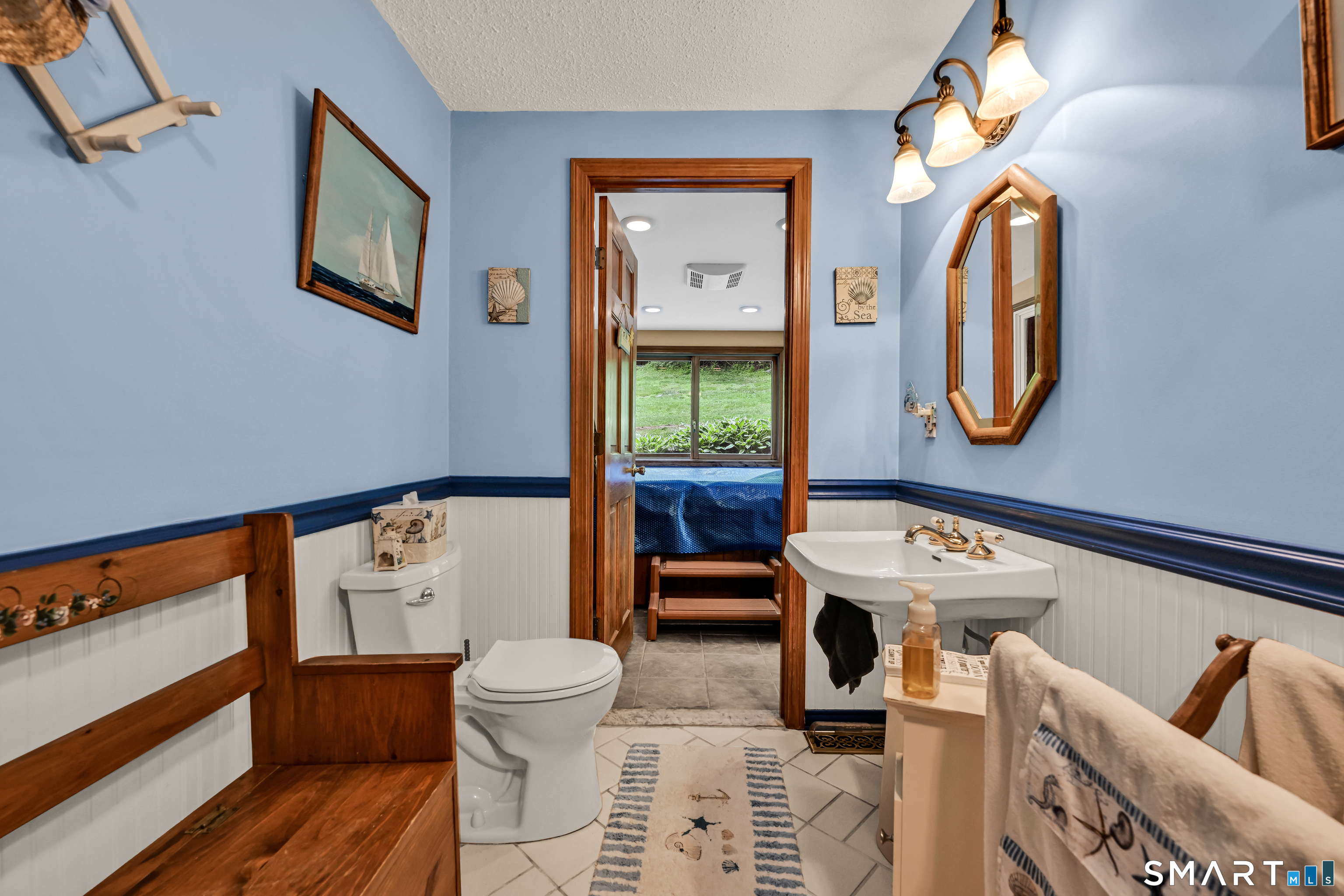 155 Lake Harwinton Road Harwinton, CT 06791 - Photo 32 of 39 a bathroom with a toilet a sink and a mirror