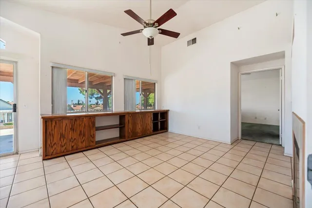 a view of an empty room with a fireplace