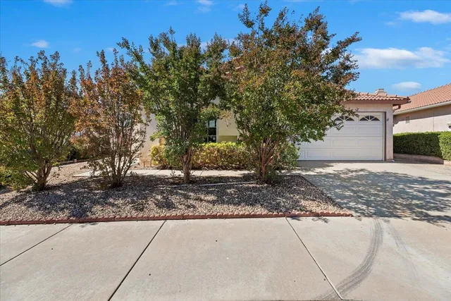a view of a house with a tree