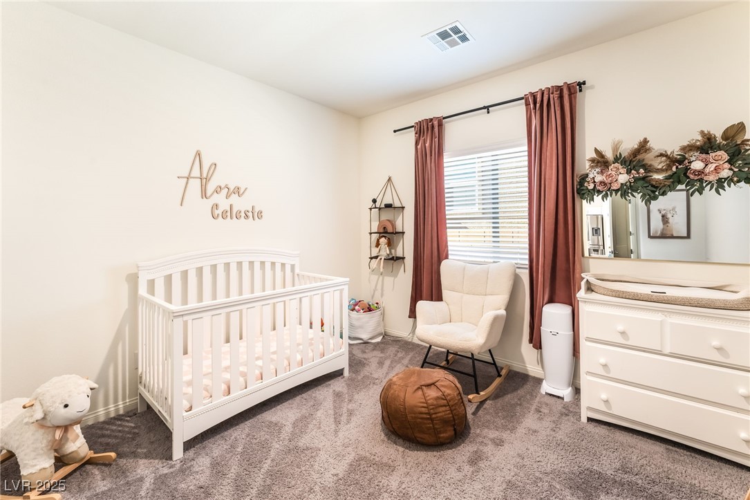 10947 Artisan Ranch Avenue Las Vegas, NV 89166 - Photo 22 of 39 Bedroom featuring carpet and a nursery area