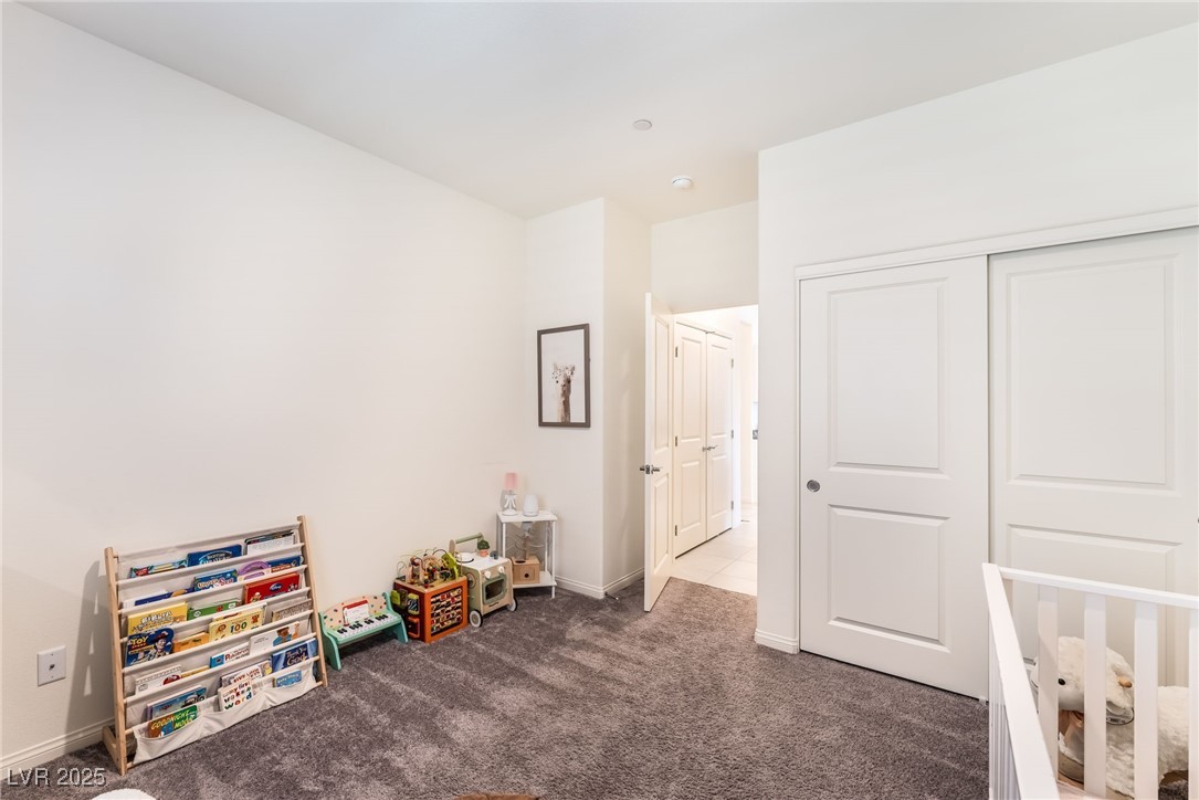 10947 Artisan Ranch Avenue Las Vegas, NV 89166 - Photo 23 of 39 Carpeted bedroom with a closet
