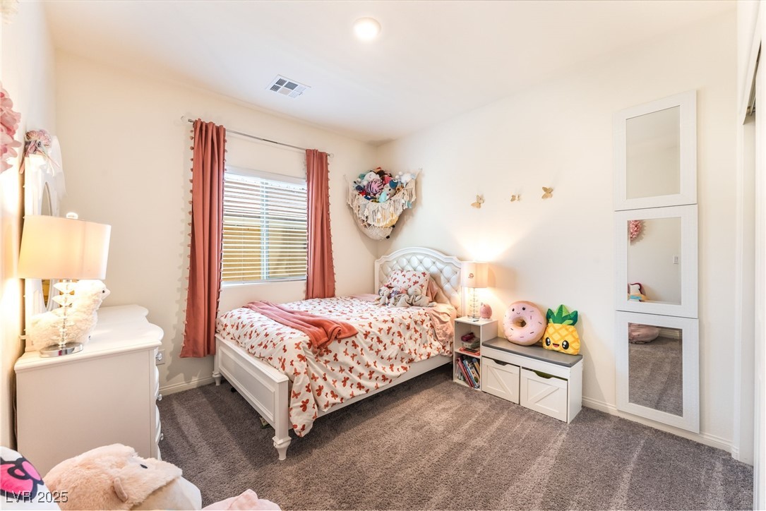 10947 Artisan Ranch Avenue Las Vegas, NV 89166 - Photo 27 of 39 Bedroom with dark colored carpet