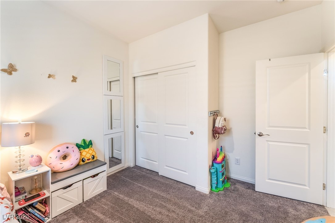 10947 Artisan Ranch Avenue Las Vegas, NV 89166 - Photo 28 of 39 Rec room featuring dark carpet