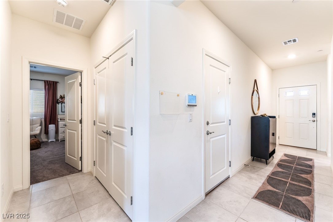 10947 Artisan Ranch Avenue Las Vegas, NV 89166 - Photo 4 of 39 Foyer featuring light tile patterned floors and recessed lighting