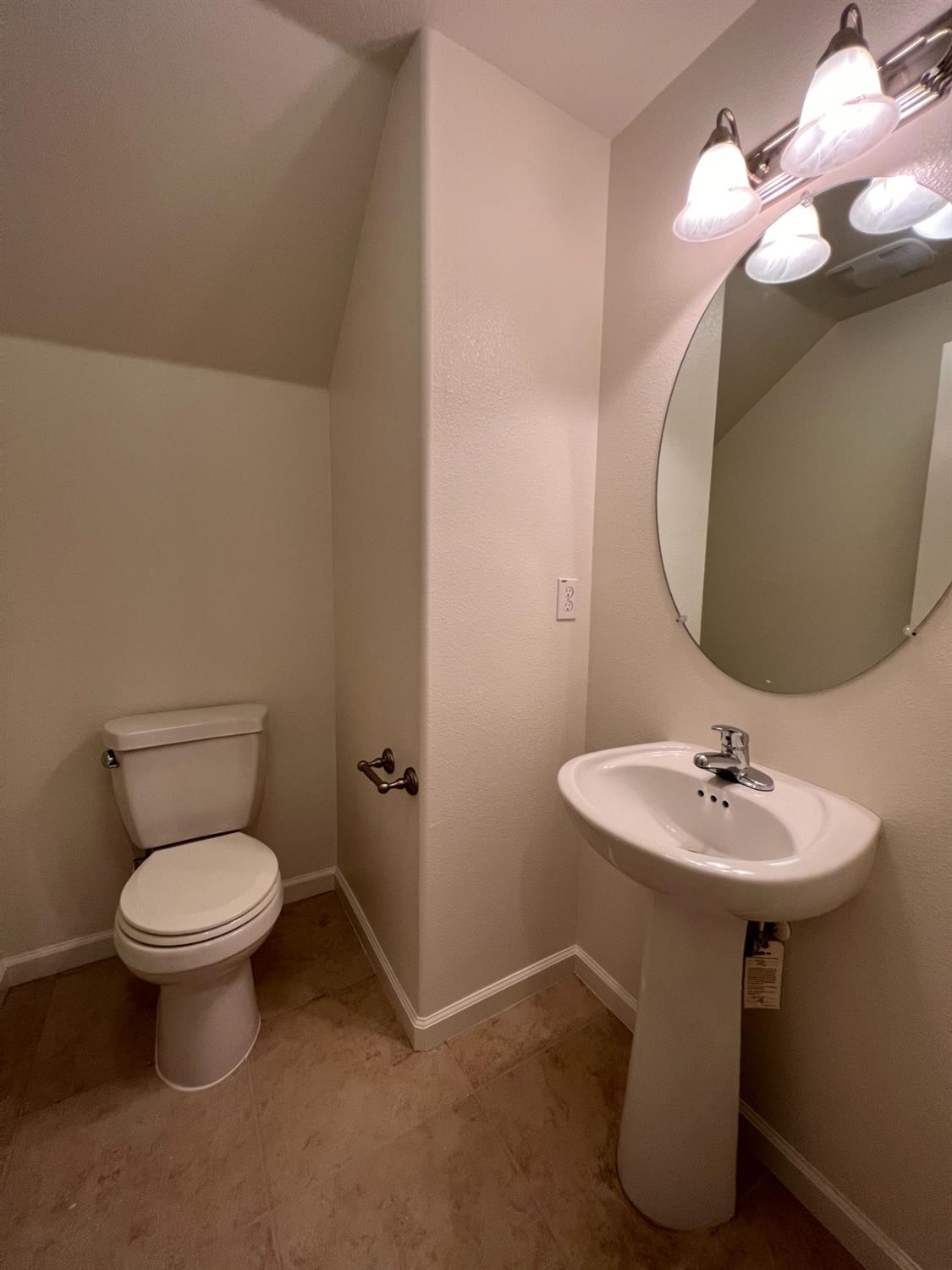 1504 Mosaic Way Clovis, CA 93619 - Photo 13 of 34 a bathroom with a sink toilet and a mirror