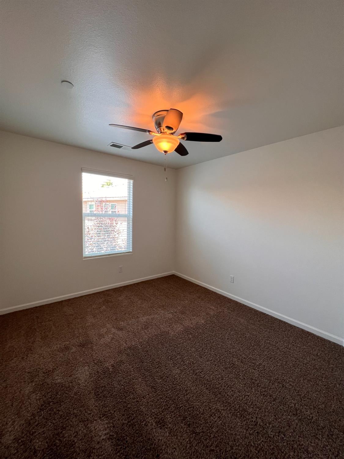 1504 Mosaic Way Clovis, CA 93619 - Photo 19 of 34 an empty room with a window