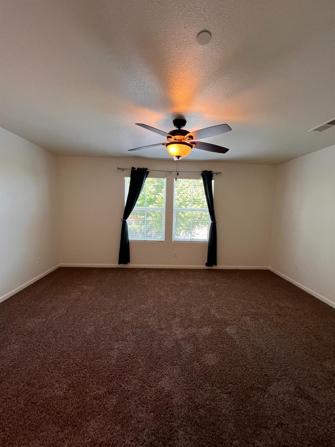 1504 Mosaic Way Clovis, CA 93619 - Photo 23 of 34 a view of an empty room with a window