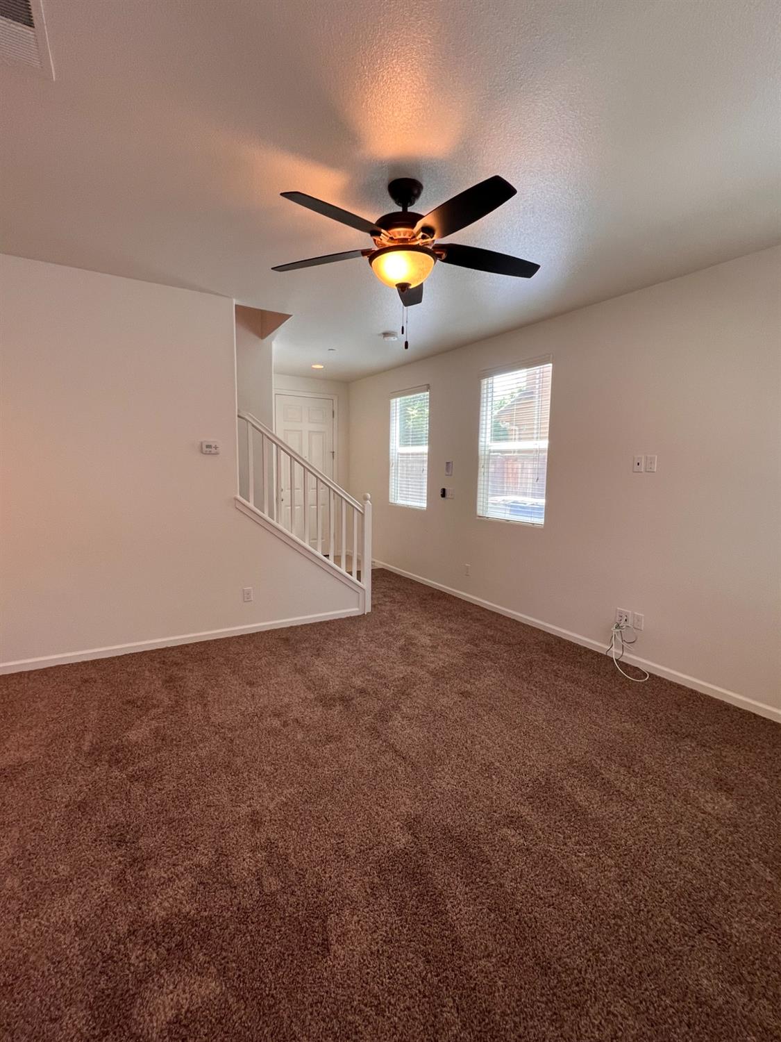 1504 Mosaic Way Clovis, CA 93619 - Photo 5 of 34 a view of an empty room with a window