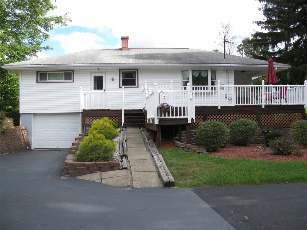 809 East Jamestown Road Jamestown, PA 16134 - Photo 2 of 25 REAR DECK/BLACK TOP DRIVEWAY/ 1 CAR INTEGRAL GARAGE