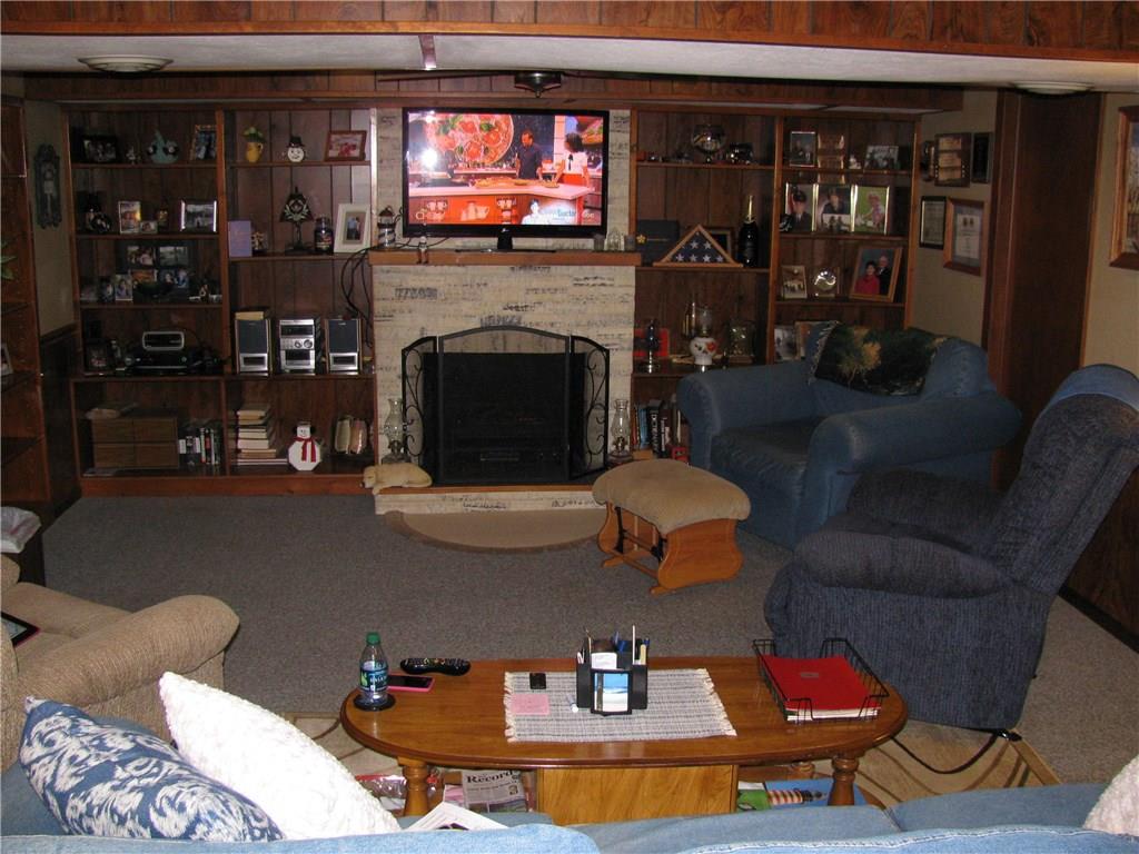 809 East Jamestown Road Jamestown, PA 16134 - Photo 18 of 25 FAUX FIREPLACE AND BUILT IN BOOK SHELVES IN F.R.