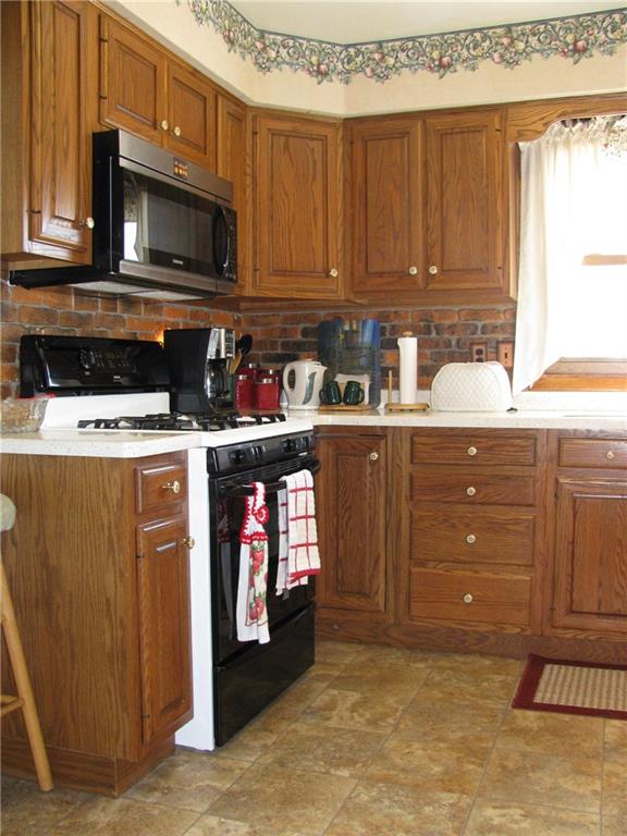 809 East Jamestown Road Jamestown, PA 16134 - Photo 4 of 25 BEAUTIFUL OAK KITCHEN WITH PULL OUT DRAWERS AND CORIAN COUNTER