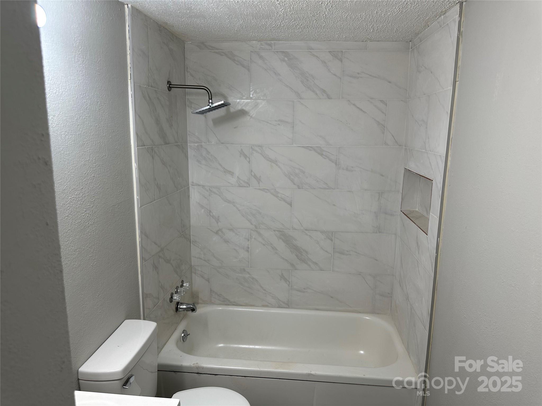 209 Brookview Road Statesville, NC 28625 - Photo 11 of 14 a bathroom with a bathtub