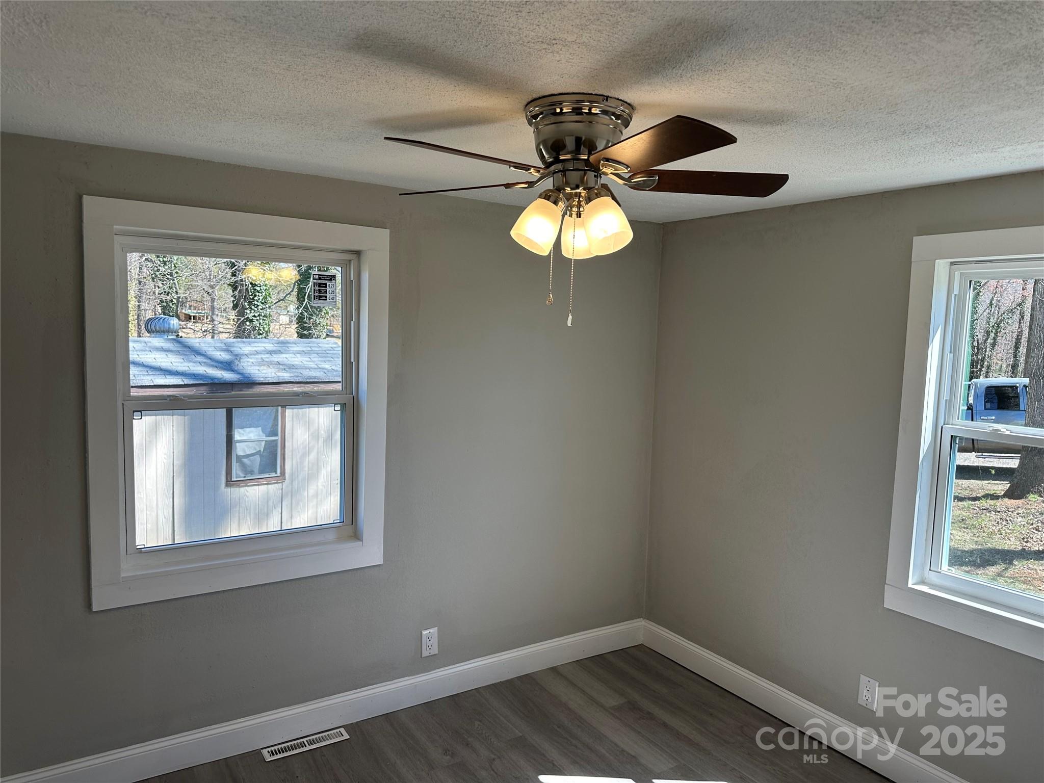 209 Brookview Road Statesville, NC 28625 - Photo 6 of 14 a view of room with a window and wooden floor