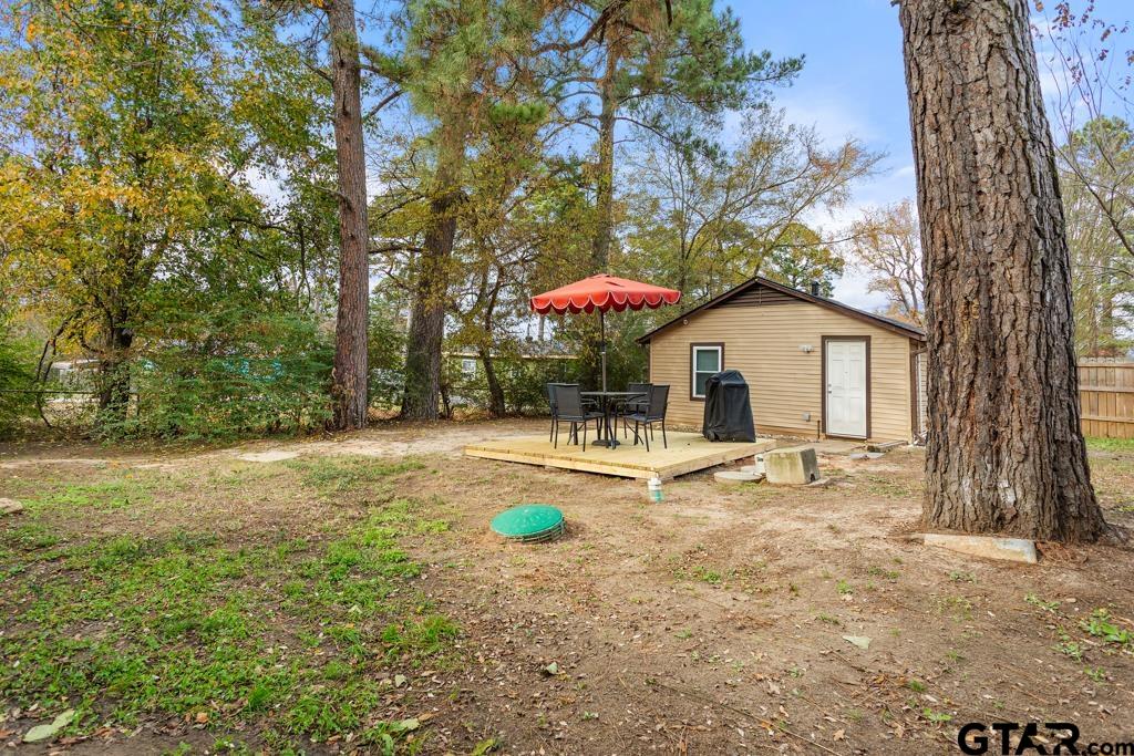 10124 County Road 280 Tyler, TX 75702 - Photo 11 of 47 a backyard of a house with table and chairs