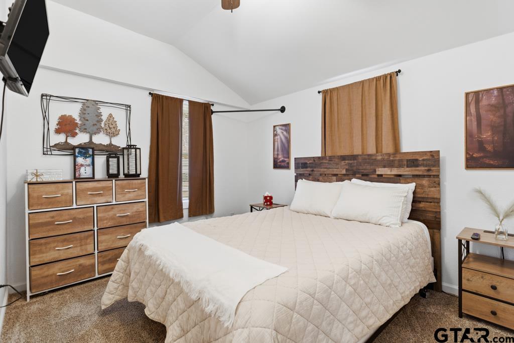 10124 County Road 280 Tyler, TX 75702 - Photo 26 of 47 a bedroom with a bed and a dresser