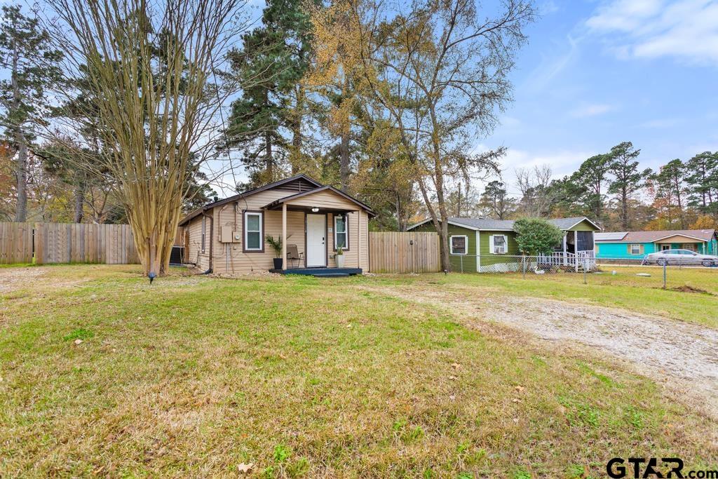 10124 County Road 280 Tyler, TX 75702 - Photo 3 of 47 a front view of a house with a garden and trees