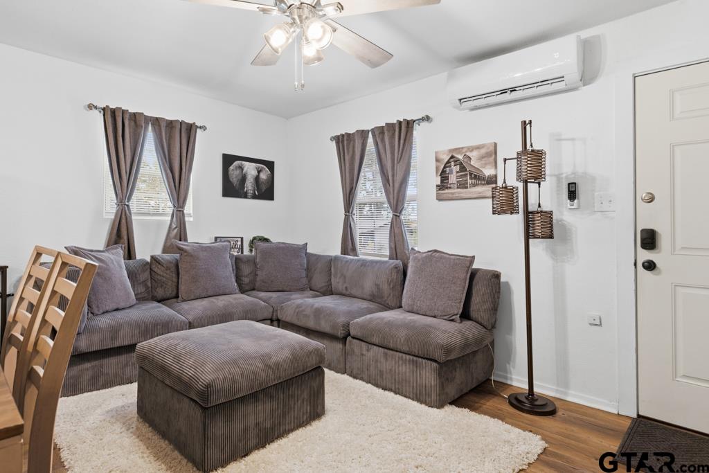 10124 County Road 280 Tyler, TX 75702 - Photo 38 of 47 a living room with furniture and a chandelier