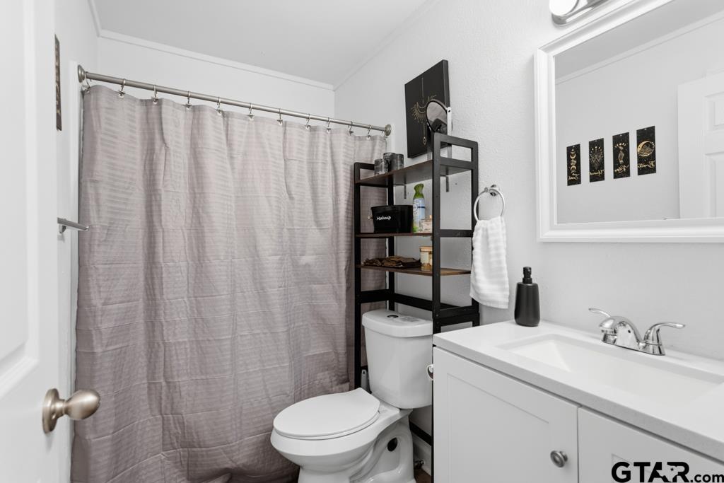 10124 County Road 280 Tyler, TX 75702 - Photo 39 of 47 a white toilet sitting next to a bathroom sink