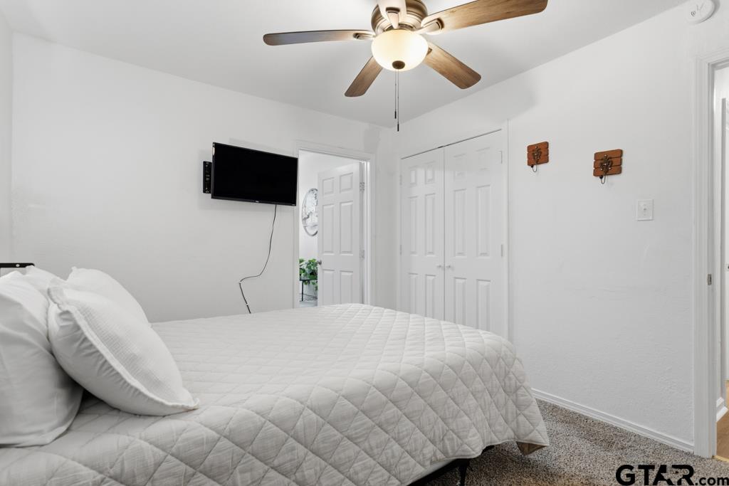 10124 County Road 280 Tyler, TX 75702 - Photo 44 of 47 a bedroom with a bed and a flat screen tv