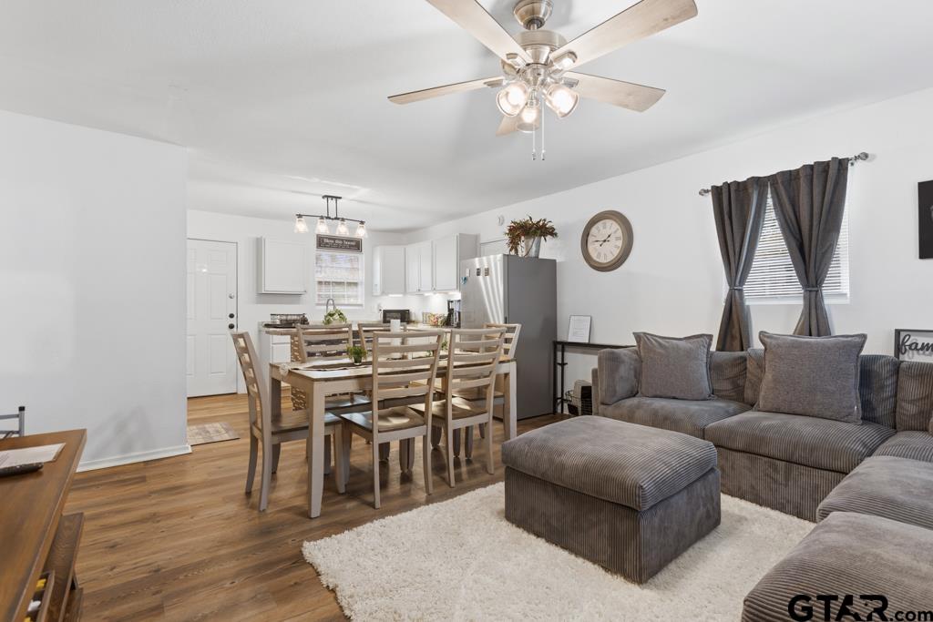 10124 County Road 280 Tyler, TX 75702 - Photo 47 of 47 a living room with furniture a wooden floor and a clock