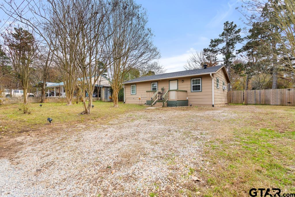 10124 County Road 280 Tyler, TX 75702 - Photo 5 of 47 a view of a yard with a house and a large tree