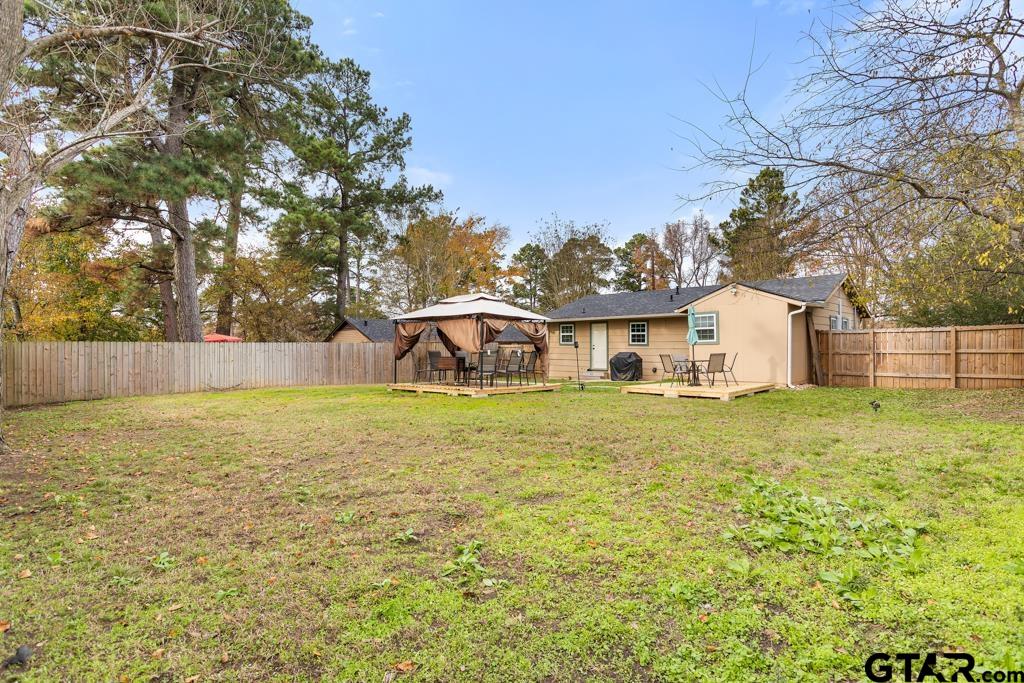 10124 County Road 280 Tyler, TX 75702 - Photo 8 of 47 a front view of a house with a yard