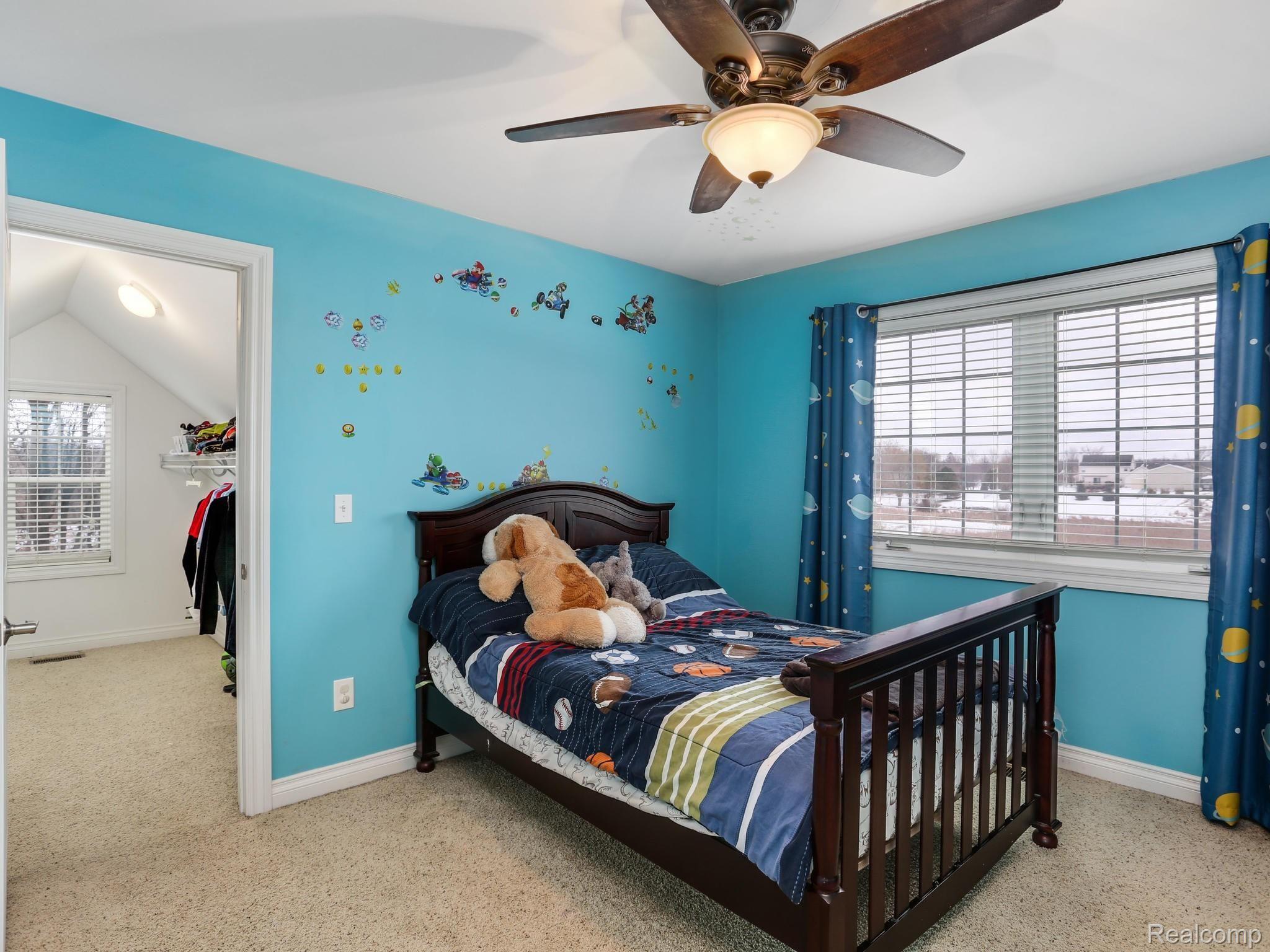 1067 Marsh Ridge Brighton, MI 48114 - Photo 25 of 39 This upstairs bedroom has a very large walk-in closet, big enough for a crafting desk and chair or a massive fort for story time.