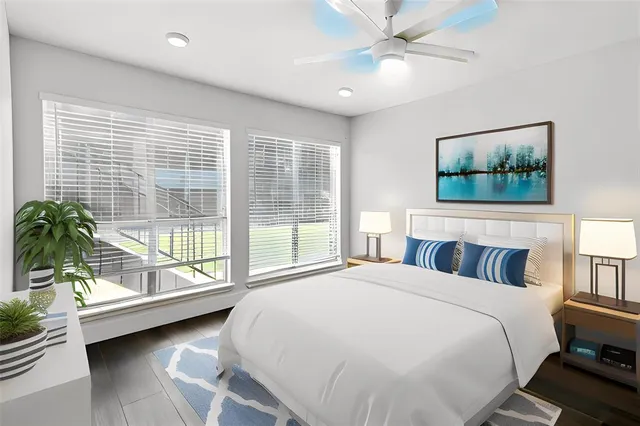 a spacious bedroom with a bed and a couch