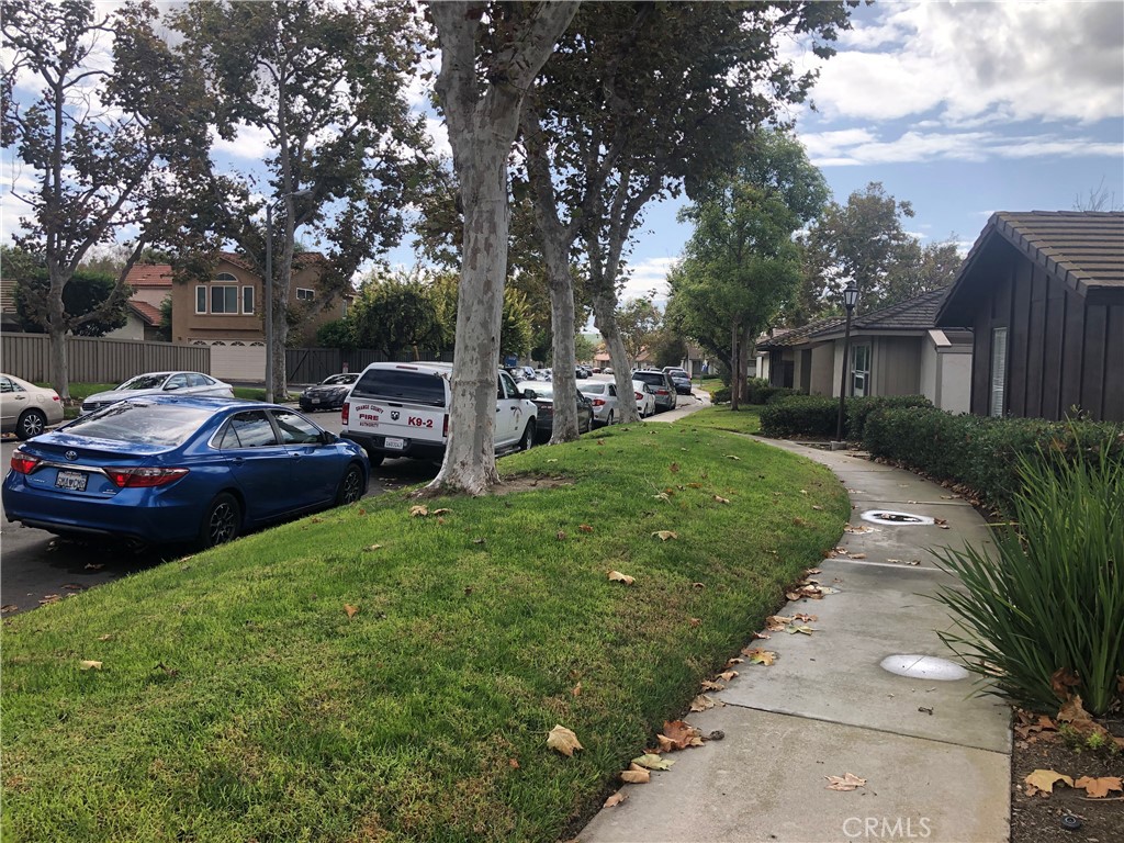 65 Orchard Irvine, CA 92618 - Photo 17 of 21 a view of a street with cars parked