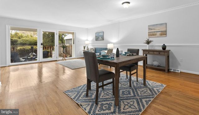 a view of a livingroom with furniture and wooden floor