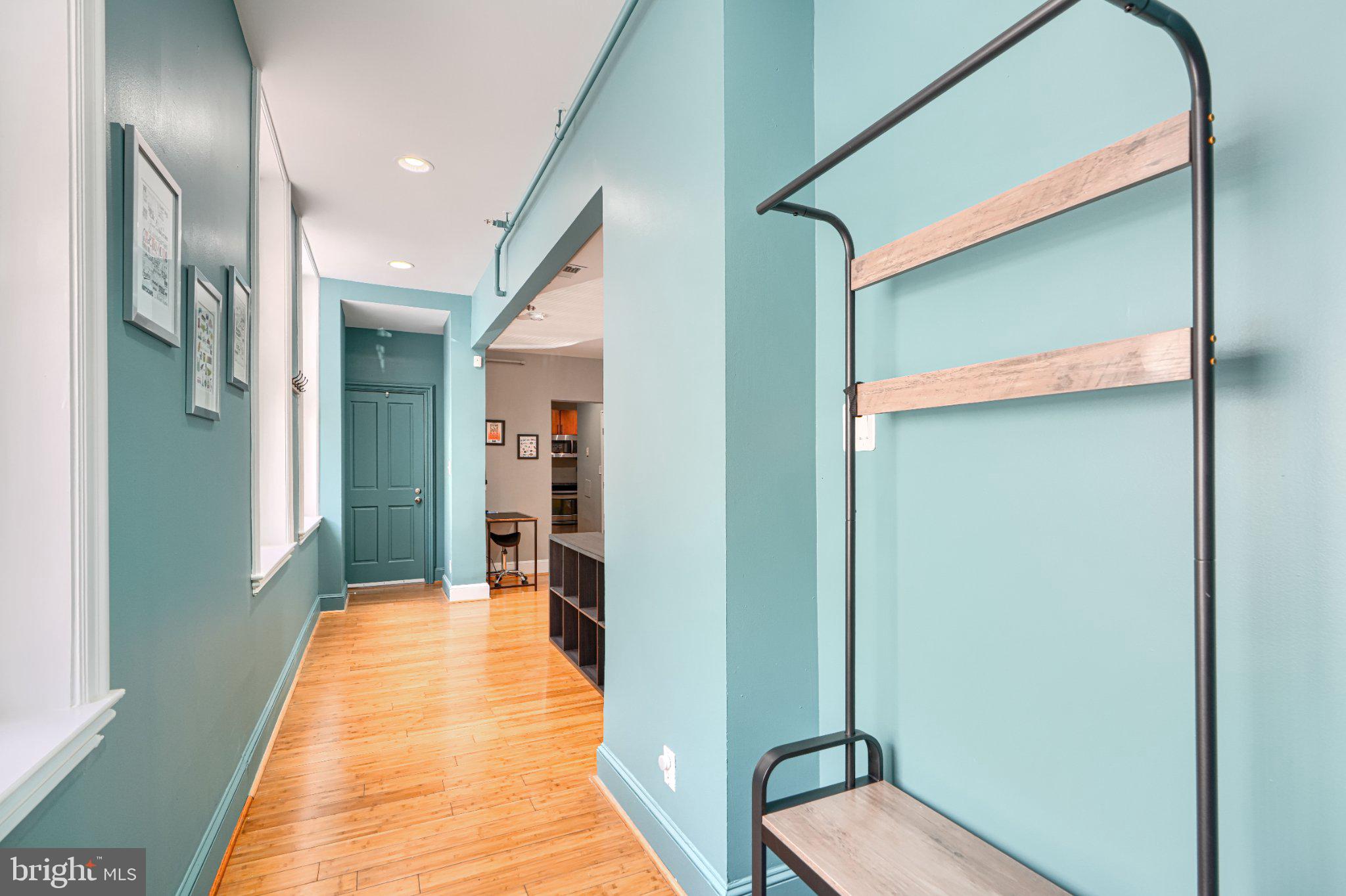 1018 North Charles Street, Unit R Baltimore, MD 21201 - Photo 15 of 17 Charming hallway with teal accents.