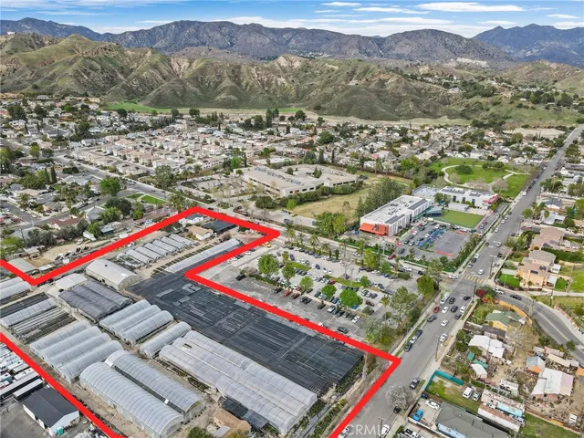 an aerial view of a red and white house
