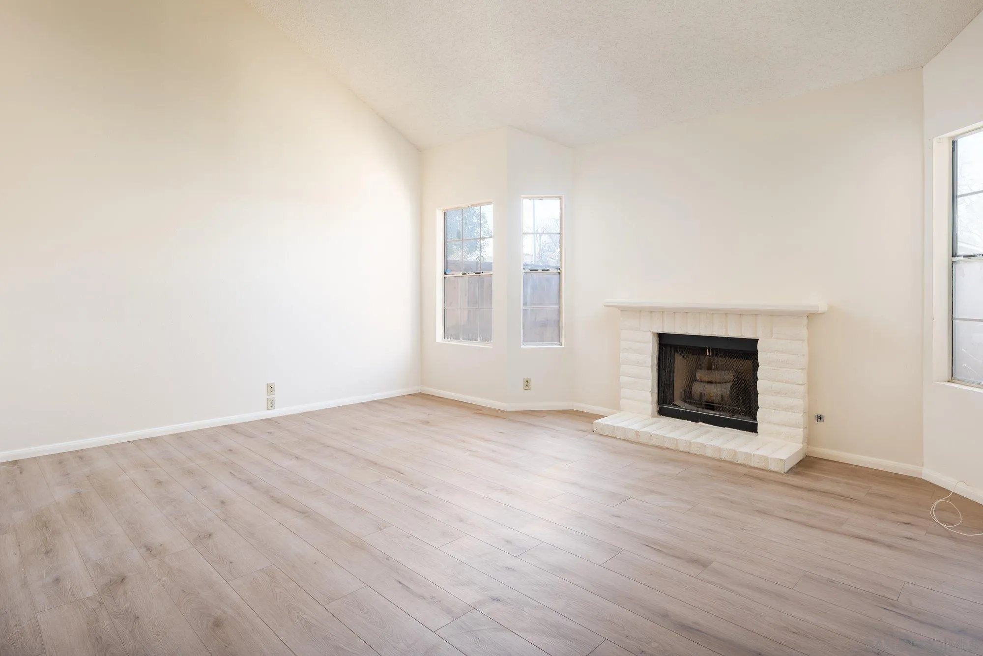 467 Nantucket Glen Escondido, CA 92027 - Photo 5 of 26 a view of an empty room with wooden floor and a window