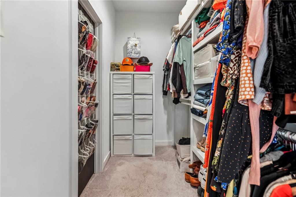 2336 Mason Drive Atlanta, GA 30316 - Photo 13 of 19 a view of walk in closet with clothes and shoes