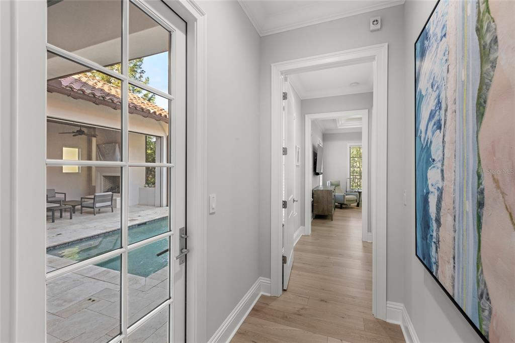 10224 Mattraw Place Orlando, FL 32836 - Photo 13 of 44 a view of a hallway view with wooden floor and staircase