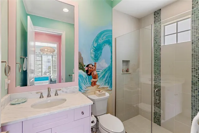 a bathroom with a toilet a sink and a mirror