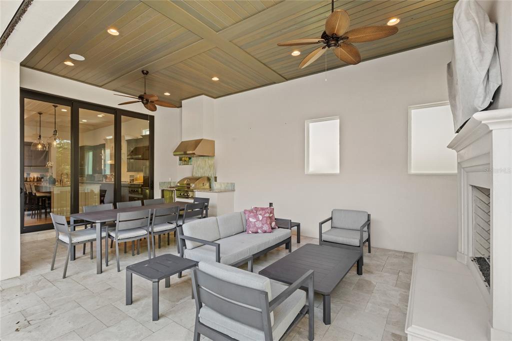 10224 Mattraw Place Orlando, FL 32836 - Photo 30 of 44 a living room with furniture and large windows