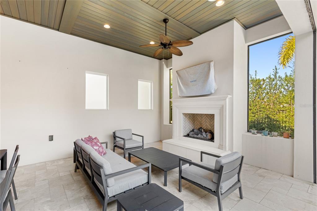 10224 Mattraw Place Orlando, FL 32836 - Photo 33 of 44 a living room with furniture and a fireplace