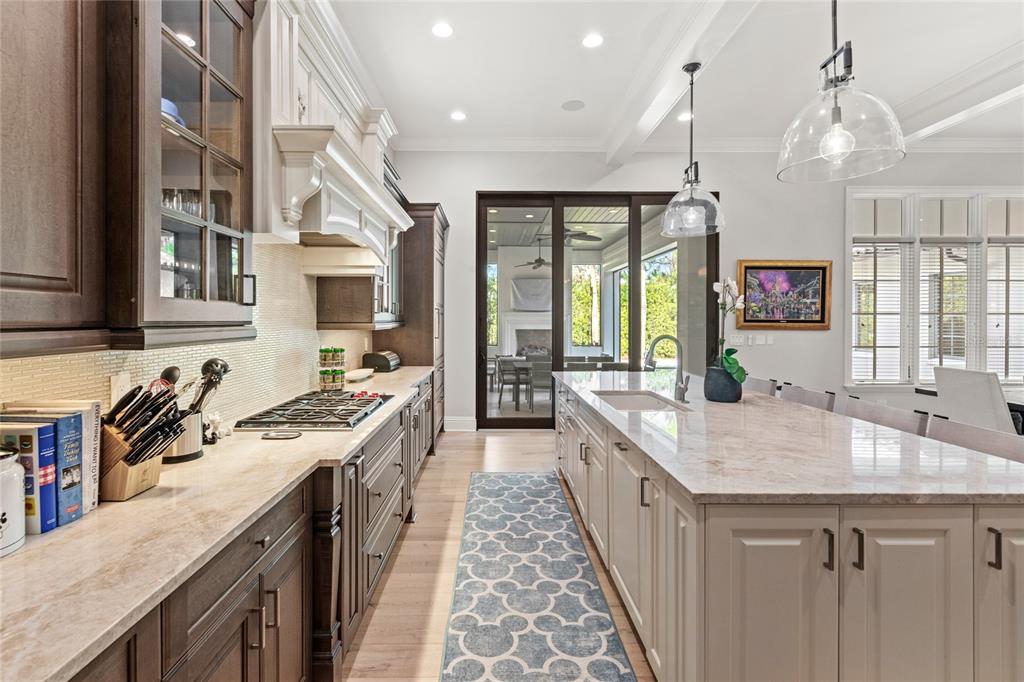 10224 Mattraw Place Orlando, FL 32836 - Photo 8 of 44 a large kitchen with kitchen island a large island in it