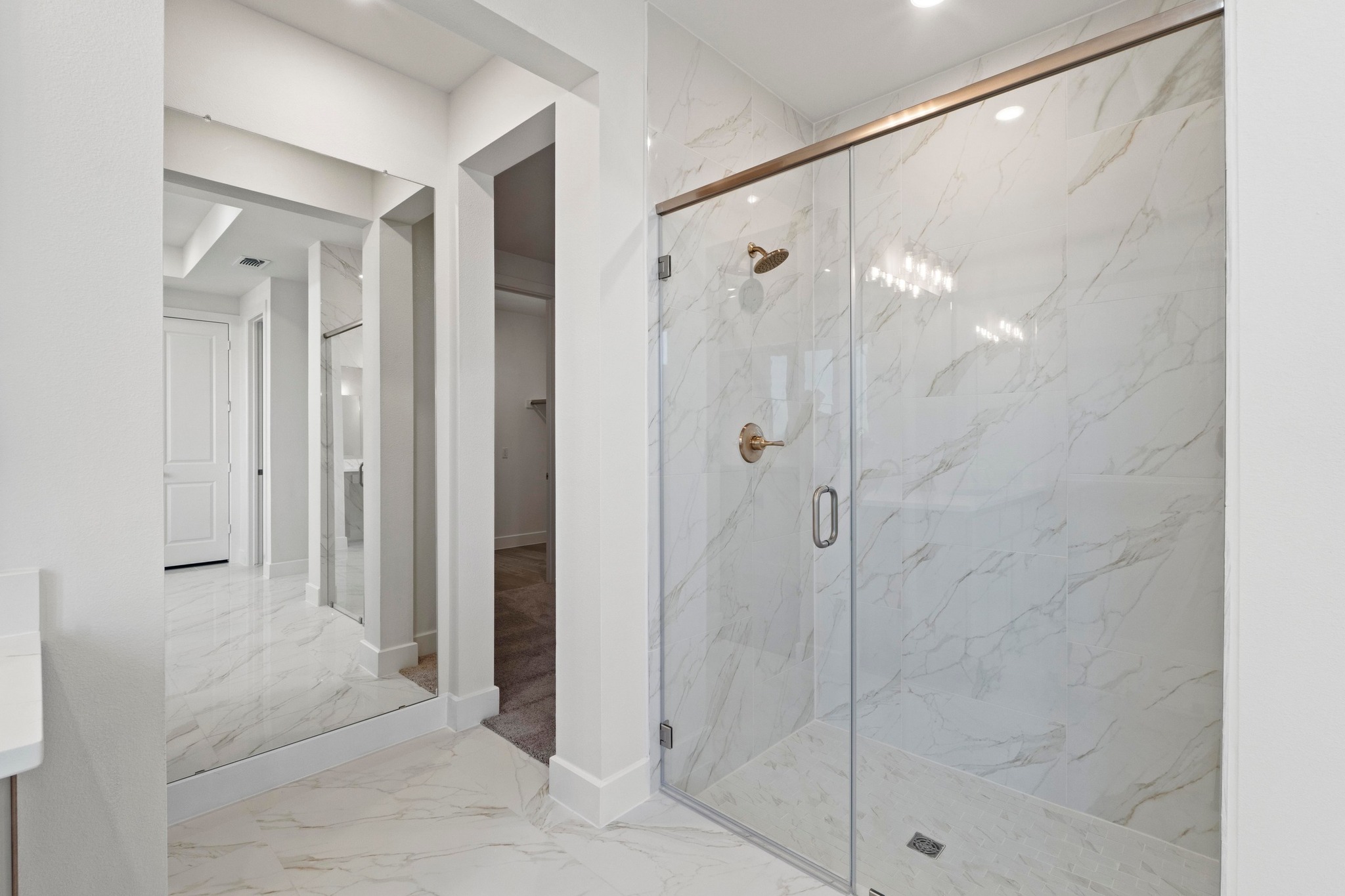 604 Lightstone Drive Georgetown, TX 78633 - Photo 13 of 39 a bathroom with a glass shower door