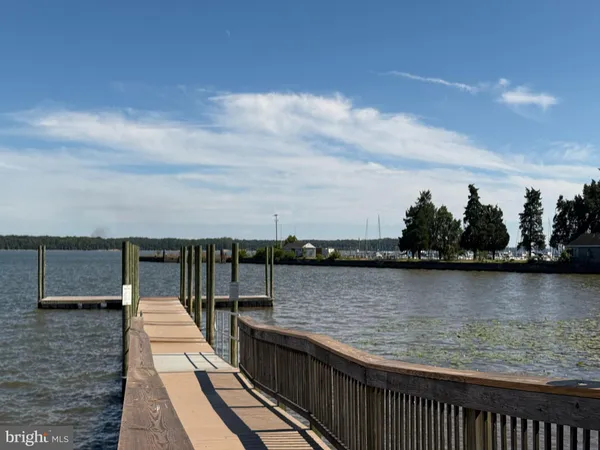 a view of a park with iron fence