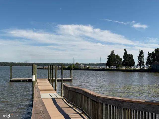 a view of a park with iron fence