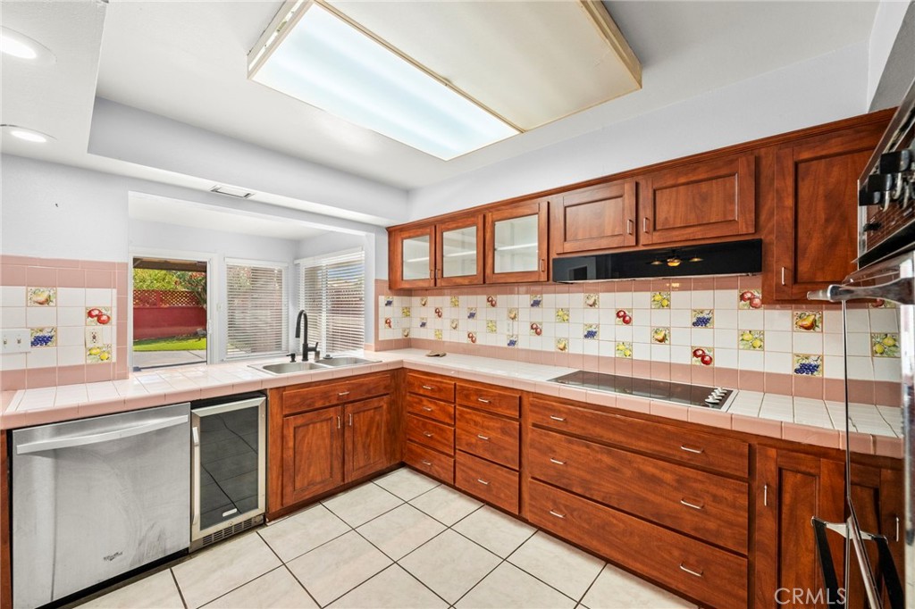 25915 Roanoke Road Menifee, CA 92586 - Photo 22 of 58 a kitchen with stainless steel appliances granite countertop a sink and cabinets